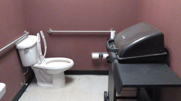 Oh look, the bathroom comes with an atheist baby changing station! (Mmm... BBQ baby!)